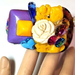 Wendy Gell bracelet. Bakelite looking yellow carved Buddha.Swarovski jewels.